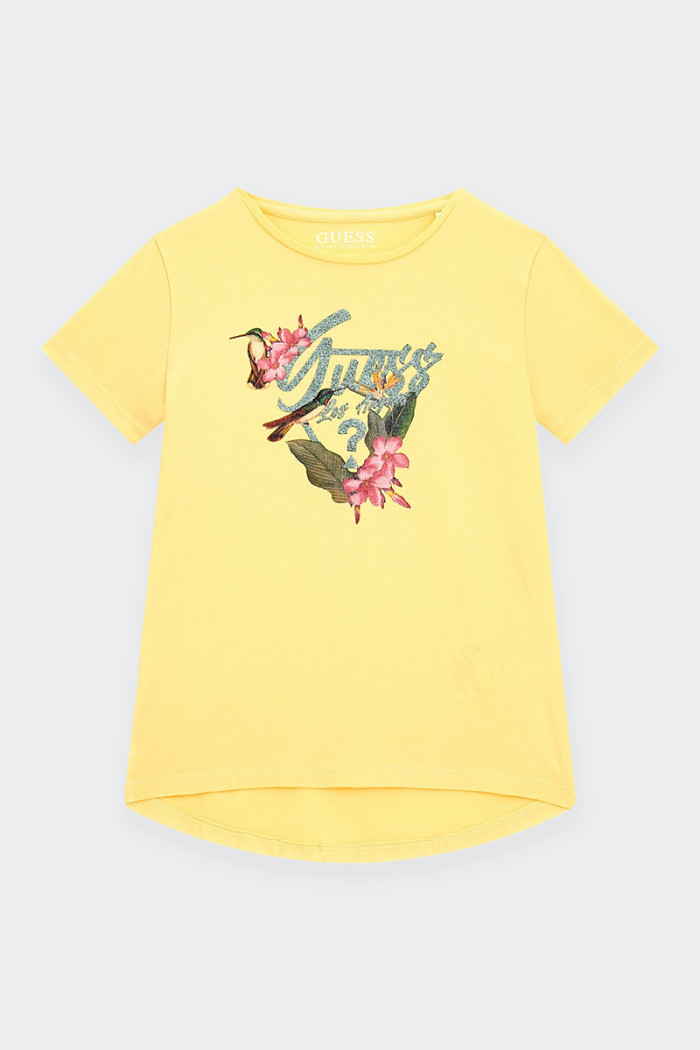 Girl's short-sleeved T-shirt made of cotton with elongated back. neckline at the base of the neck and spring-inspired logo print