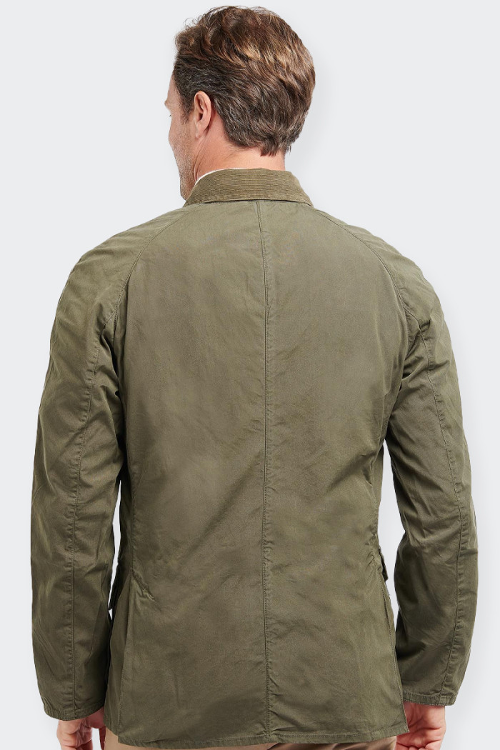 A men's half-weight jacket featuring a striped velvet collar and a zip fastening concealed by metal buttons, the Barbour Ashby C