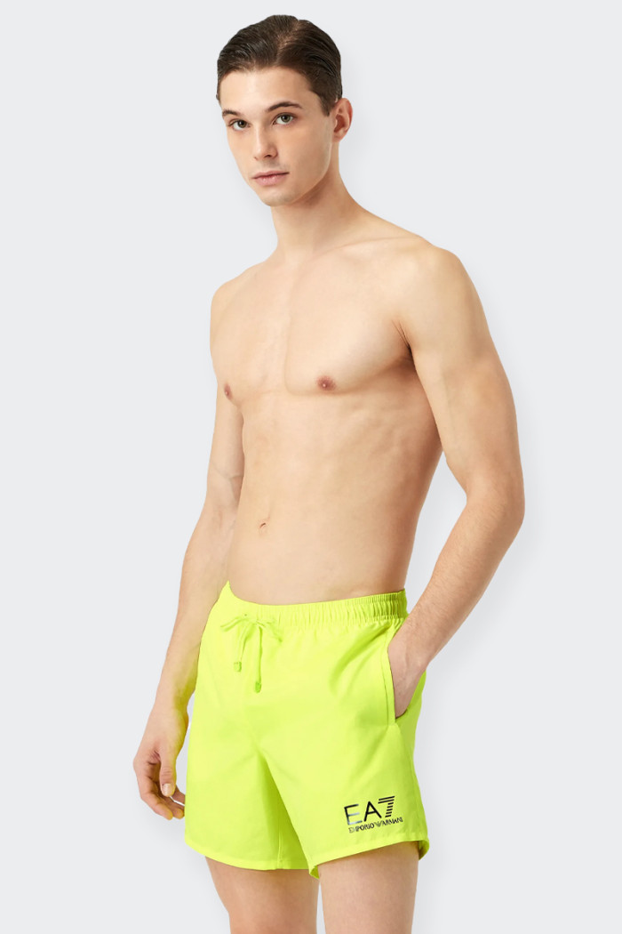 Men's swimming costume, boxer model, perfect for the pool and the beach. The garment has a convenient back pocket and is embelli