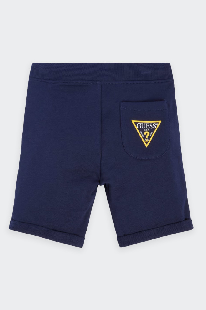 Child's Guess sweatpants with a gauzed interior that makes them suitable for any adventure. The rib-knit lined elastic and draws
