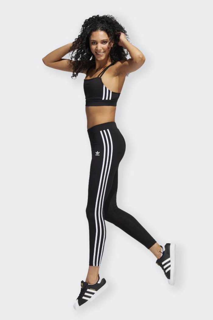 Adicolor leggings made of stretch cotton. Iconic and timeless are characterized by high waist and white stripes on the sides. Th