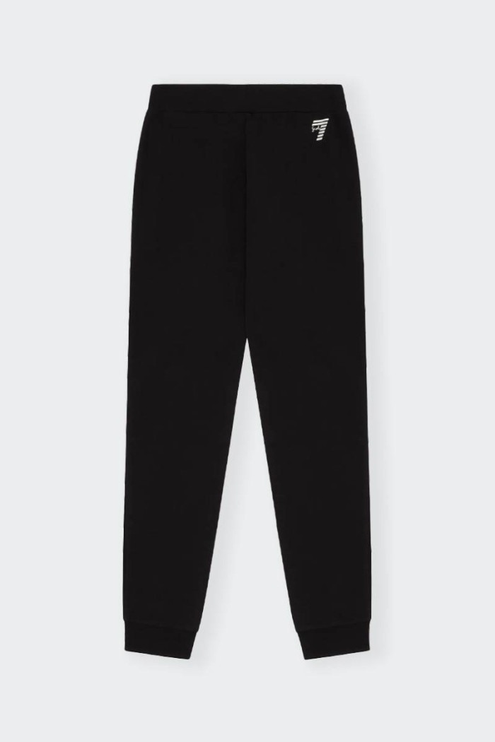 Realizzati in morbido cotone elasticizzato, questi pantaloni jogger Emporio Armani EA7 regular fit per bambina e teenager sono p