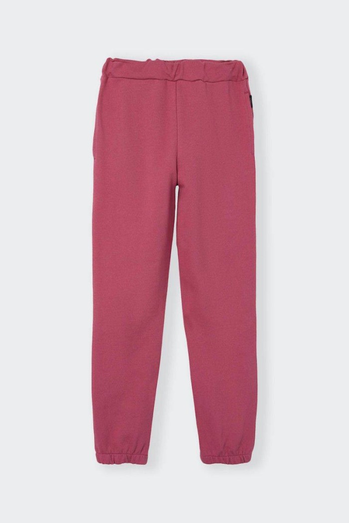 Practical sporty regular fit tracksuit trousers for girls and teenagers. Adjustable drawstring waist with comfortable welt pocke