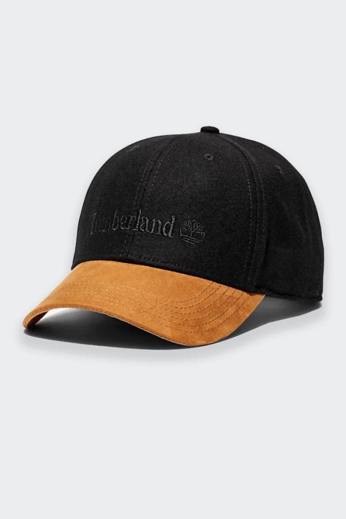 This vintage-style men's cap sports a two-tone wool-blend look with a synthetic suede visor. Adjustable back strap and embroider