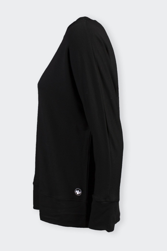Black Oversized long-sleeved sweater. Featuring double back stitching and embroidered patch on the side. Warm and comfortable to