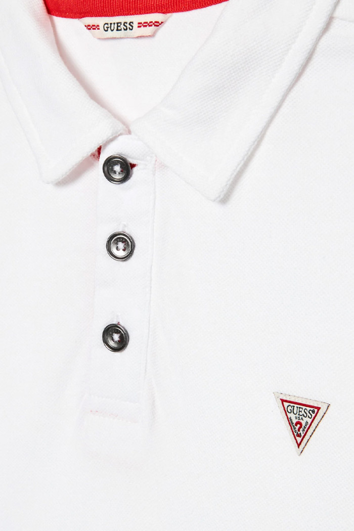 White 100% cotton boy's and boy's short-sleeved polo shirt with front button placket and polo collar. Pique weave fabric. Regula