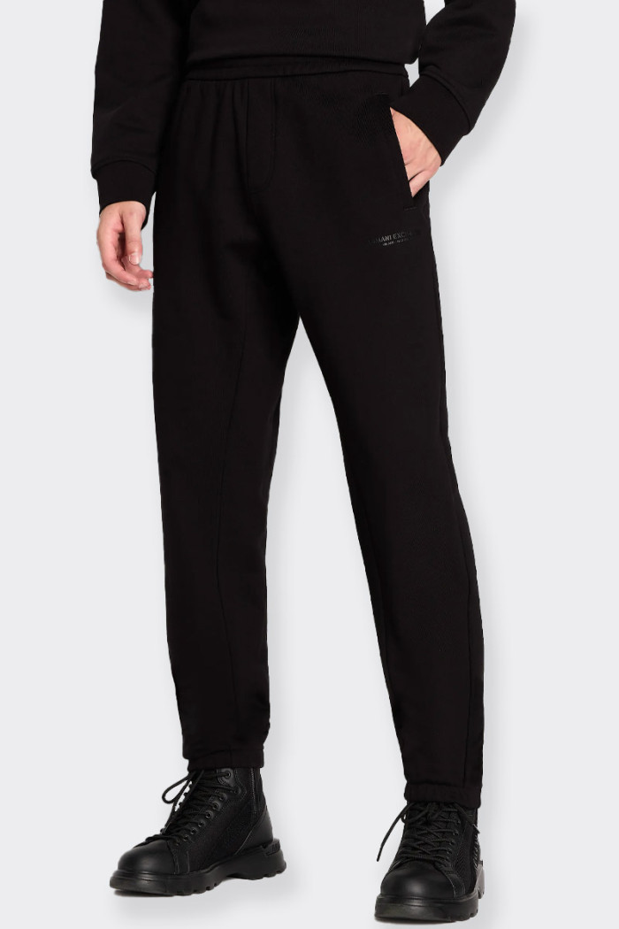 men’s black jogger pants made of French terry cotton with sporty style. Side pockets and a welt on the back side featuring the m