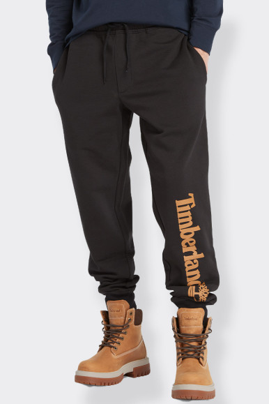 A regular-fit men's joggers feature a drawstring waist and ribbed leg bottoms, while the Timberland logo on the leg adds a contr